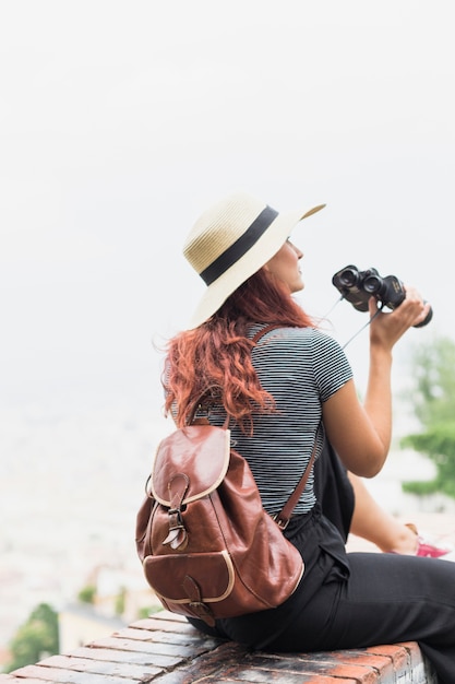 Female tourist with binoculars