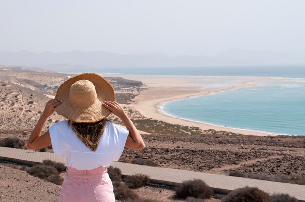 Female traveler enjoying a luxurious trip by the sea