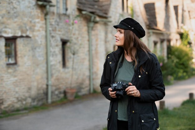 Female traveler using a professional camera for new memories