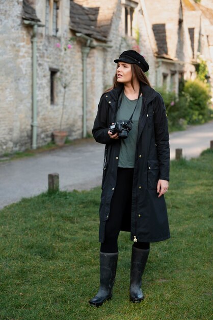 Female traveler using a professional camera for new memories