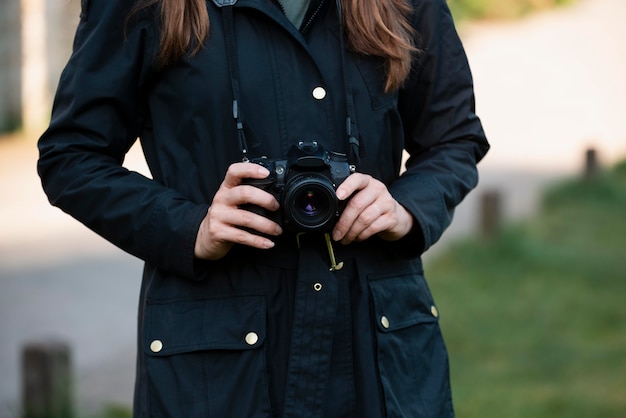 Female traveler using a professional camera for new memories