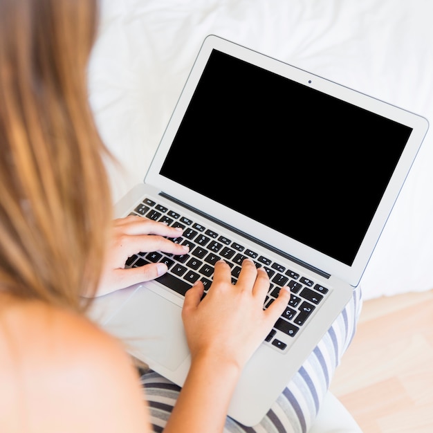 Female typing on laptop 