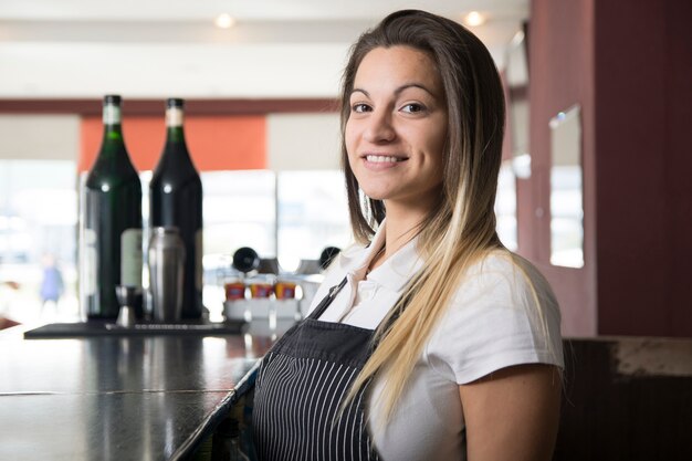 Female waitress in the bar