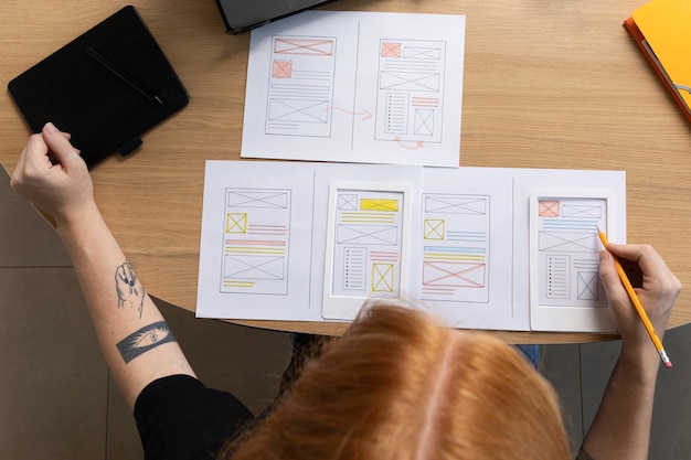 Female web designer in the office with notebook