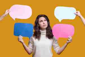 Free photo female with colorful cardboard tablets in her hands staring upwards