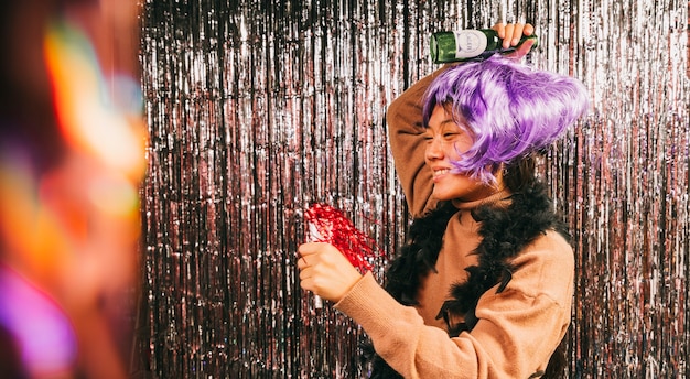 Female with wig dancing at carnival party