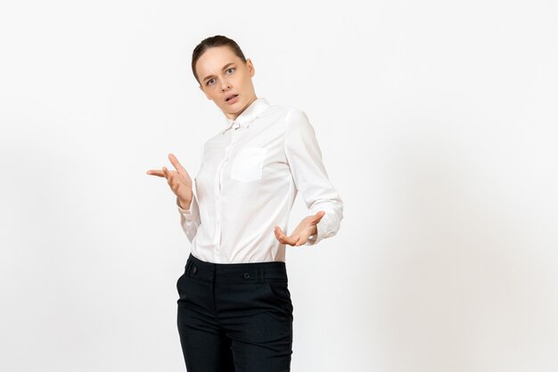 female worker in elegant white blouse with confused face on white