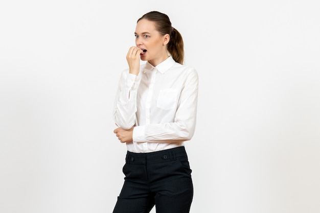 female worker in elegant white blouse with nervous face on white