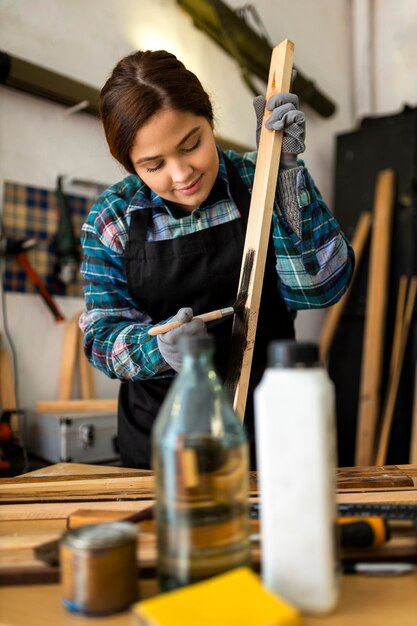 Female in workshop painting