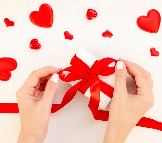 Female wrapping valentine gift