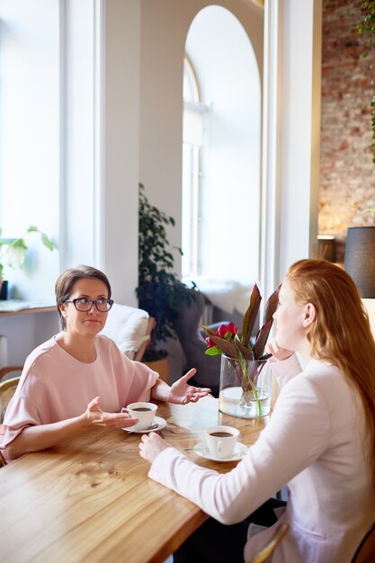 Females having coffee