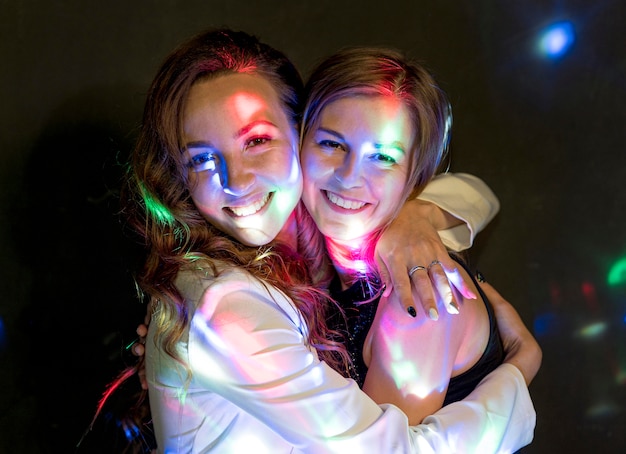 Free photo females hugging at party