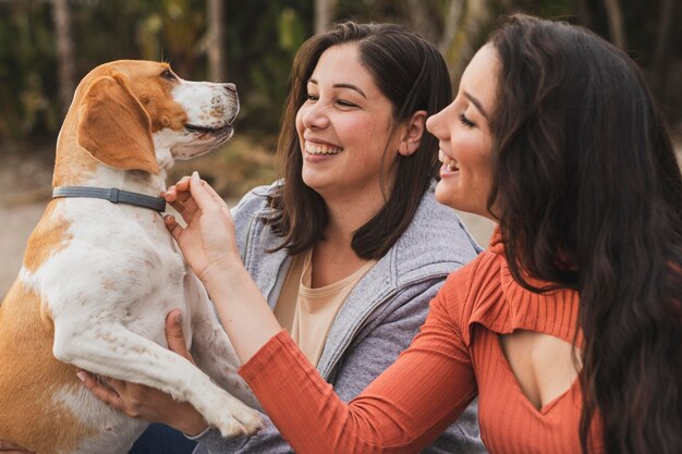 Females playing with dog