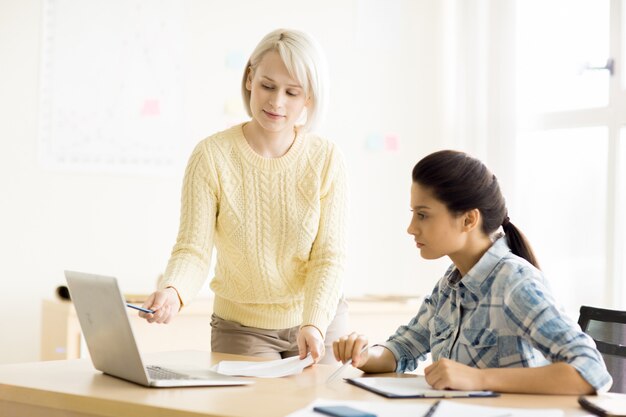 Females working in neat office together