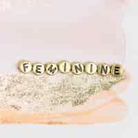 Free photo feminine gold word beads