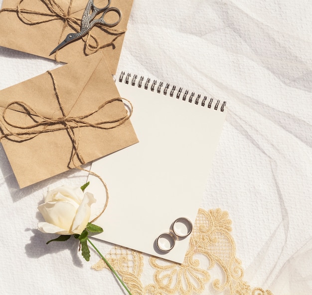 Feminine wedding arrangement with notepad close-up