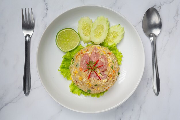 Fermented pork fried rice served with fresh cucumber