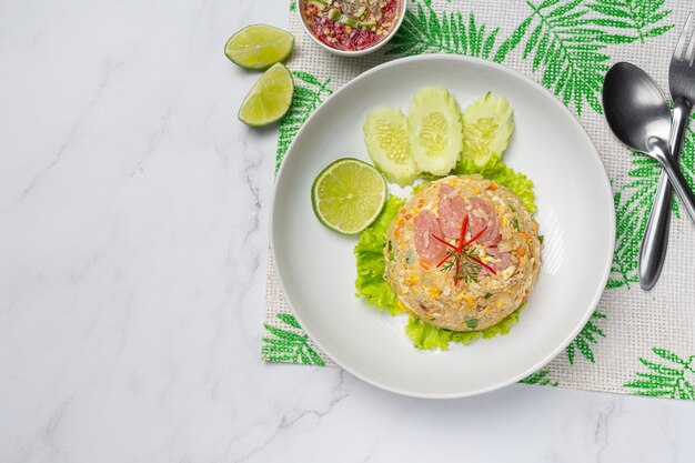 Fermented pork fried rice served with fresh cucumber