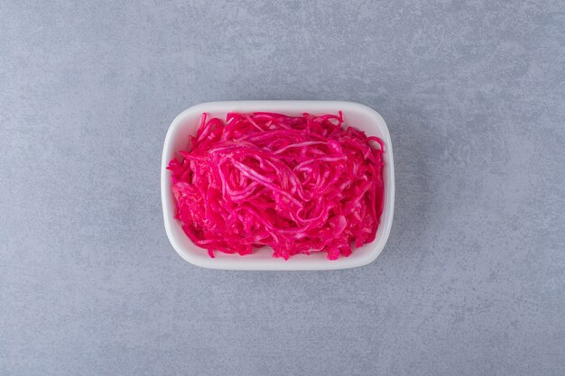 Fermented red cabbage lies in bowl