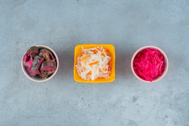 Free photo fermented vegetables in bowl , on the marble table.