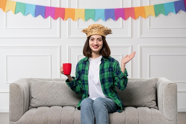 Festa junina cute lovely girl in green shirt straw hat with colorful flags super cheerful