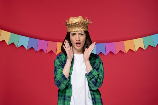 Festa junina happy cute girl wearing straw hat celebrating brazilian festival screaming