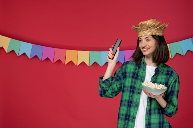 Free photo festa junina lovely cute girl wearing hat celebrating brazilian festival watching funny show