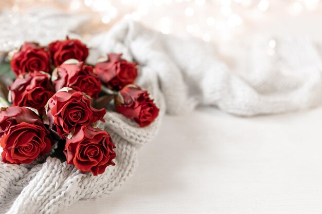 Festive background for Valentine39s Day with a bouquet of red roses copy space