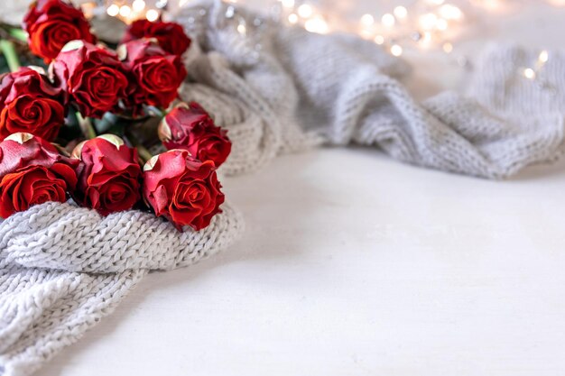 Festive background for Valentine39s Day with a bouquet of red roses copy space