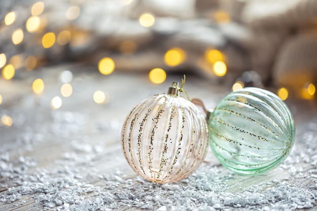 Festive background with christmas balls and blurred bokeh lights copy space