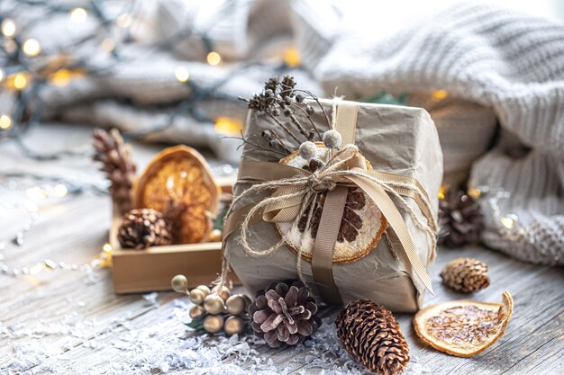 Festive background with christmas gift on blurred background with bokeh