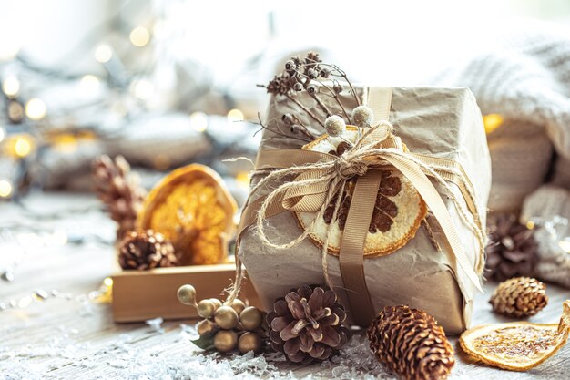 Festive background with christmas gift on blurred background with bokeh.