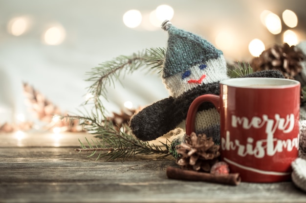Festive background with a Cup and the inscription merry Christmas.
