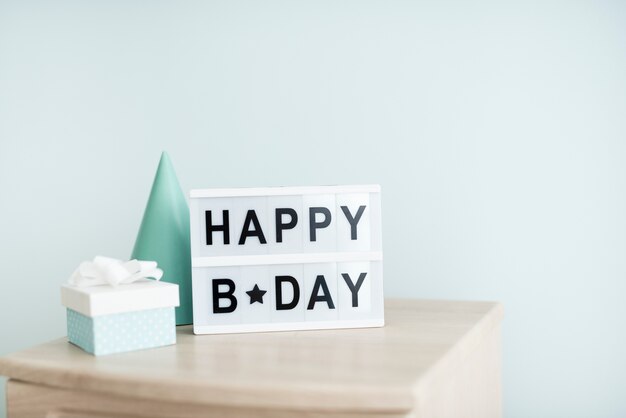 Festive birthday signboard on table