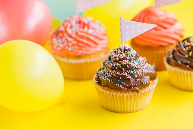 Festive cupcakes and balloons