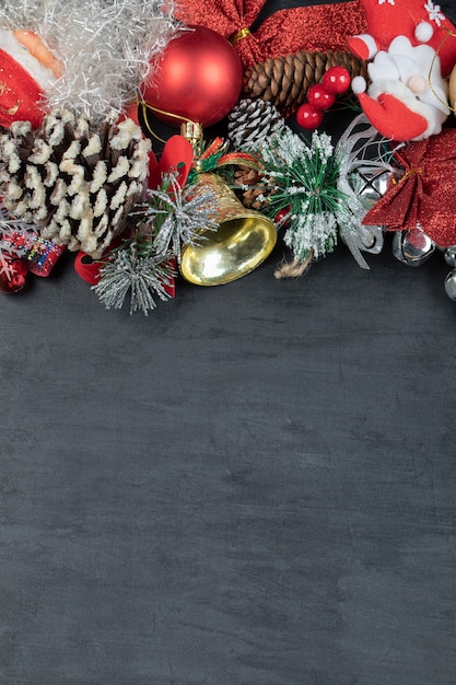 Festive dark surface with ornaments and figurines