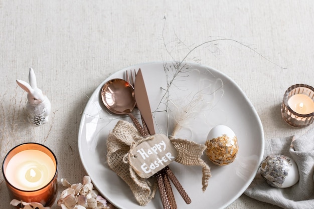 Festive easter table setting with decor details on white table