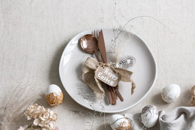 Festive easter table setting with decor details on white table