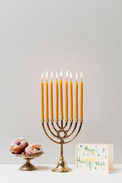 Free photo festive hanukkah candleholder with sweets