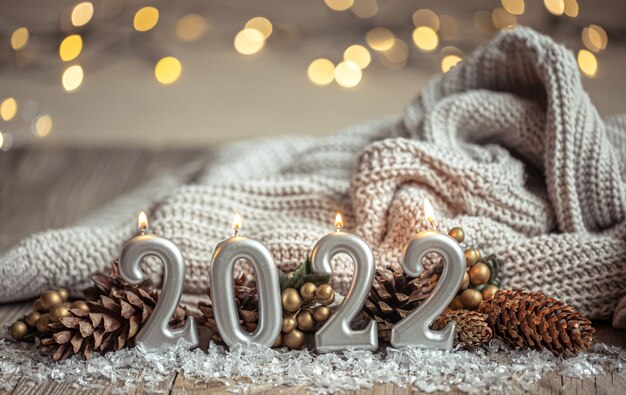 Festive new year background with candles in the form of the numbers