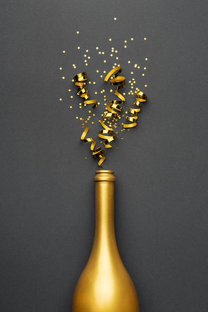 Free photo festive new year composition with golden bottle