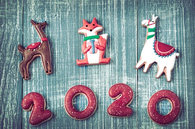 Festive new year gingerbread on a wooden wall.