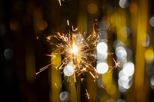 Festive shiny sparkler in the dark