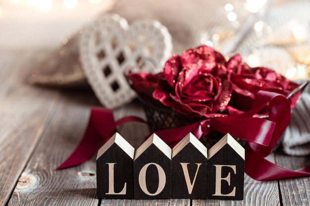 A festive still life with home decor details on a wooden surface against a blurred background with bokeh.