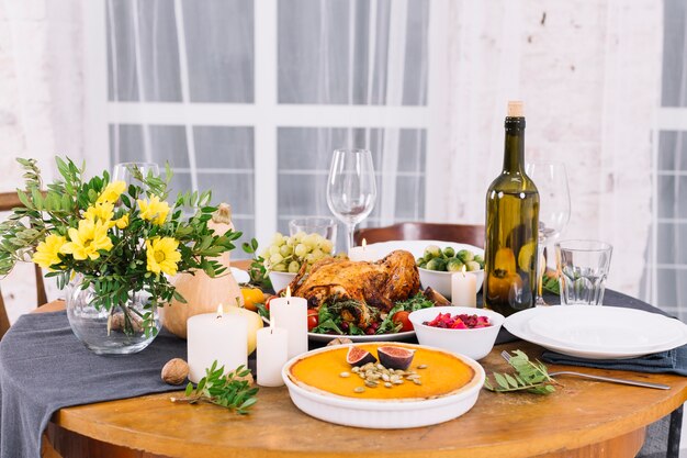 Festive table with baked chicken and wine 