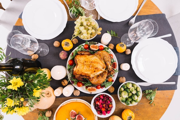 Festive table with roasted chicken 