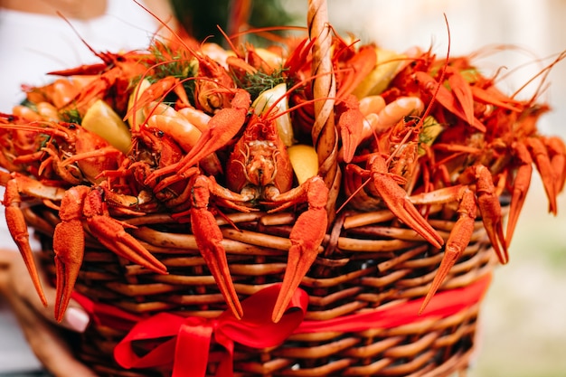 Festive woven gift basket for a man with crayfish and lemons