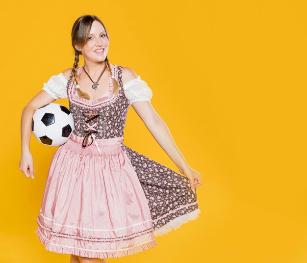 Festive young girl with football