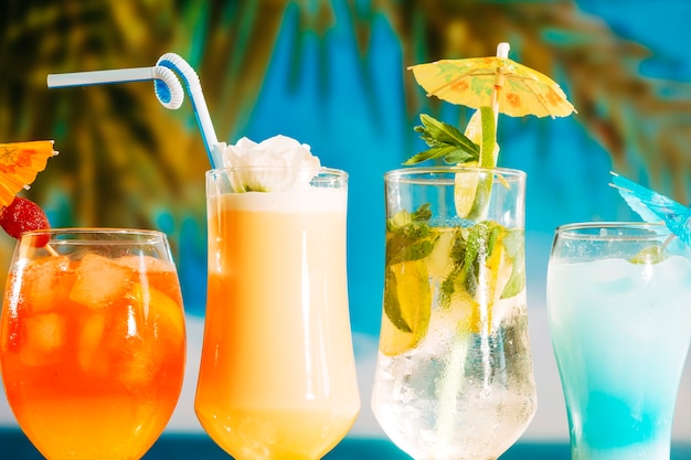 Festively umbrella decorated bright orange yellow and blue drinks