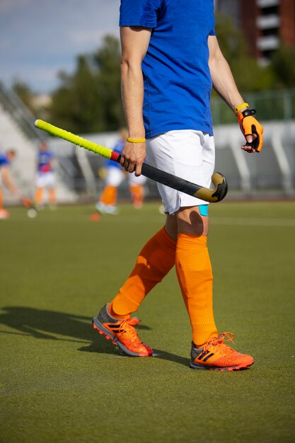 Field hockey player training and practicing the sport on grass